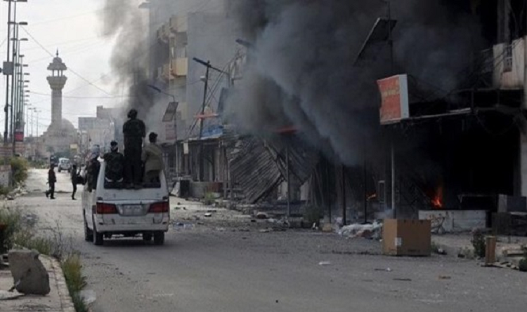 بلومبرغ الأمريكية:القوات الامريكية لم تمنع داعش من احتلال الرمادي!