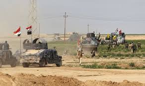 مكافحة الارهاب:رفع العلم العراقي فوق مبنى قيادة عمليات الانبار
